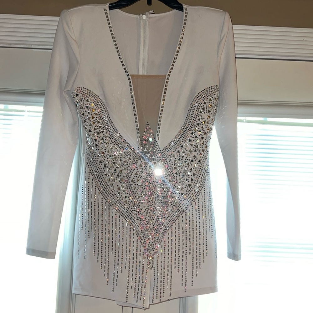 Women’s boutique White studded romper, zip closure on the back.